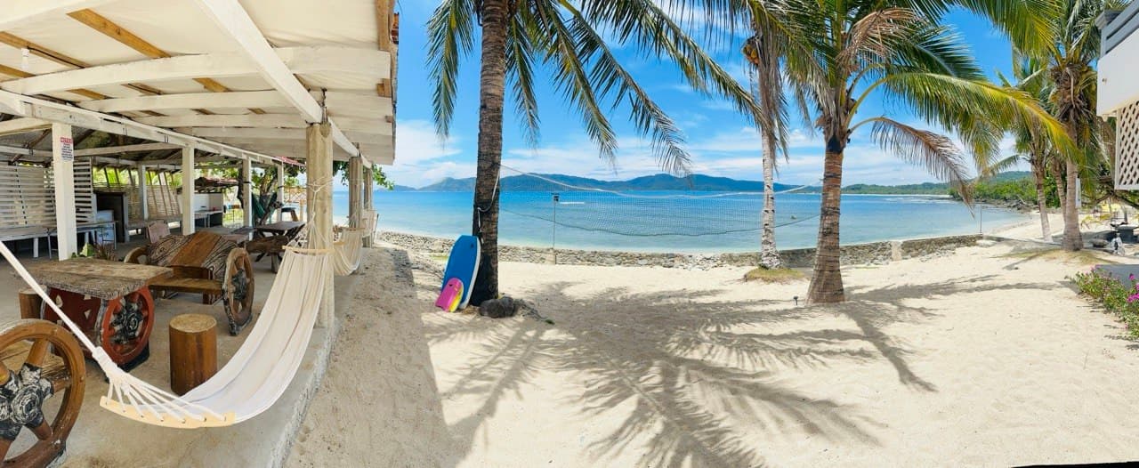 Hammocks, palms, and the bay from the Luntiya common area